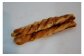 ●たっぷりチーズパン　ハード系の平焼きパンの上にミックスチーズ、プロセスチーズ、ブロックベーコンなどがたっぷりのっています。